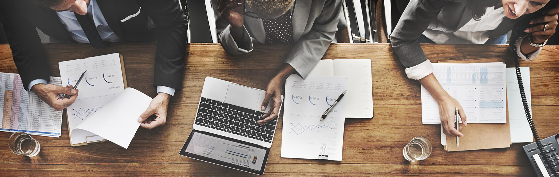 Abstract image of business people at table