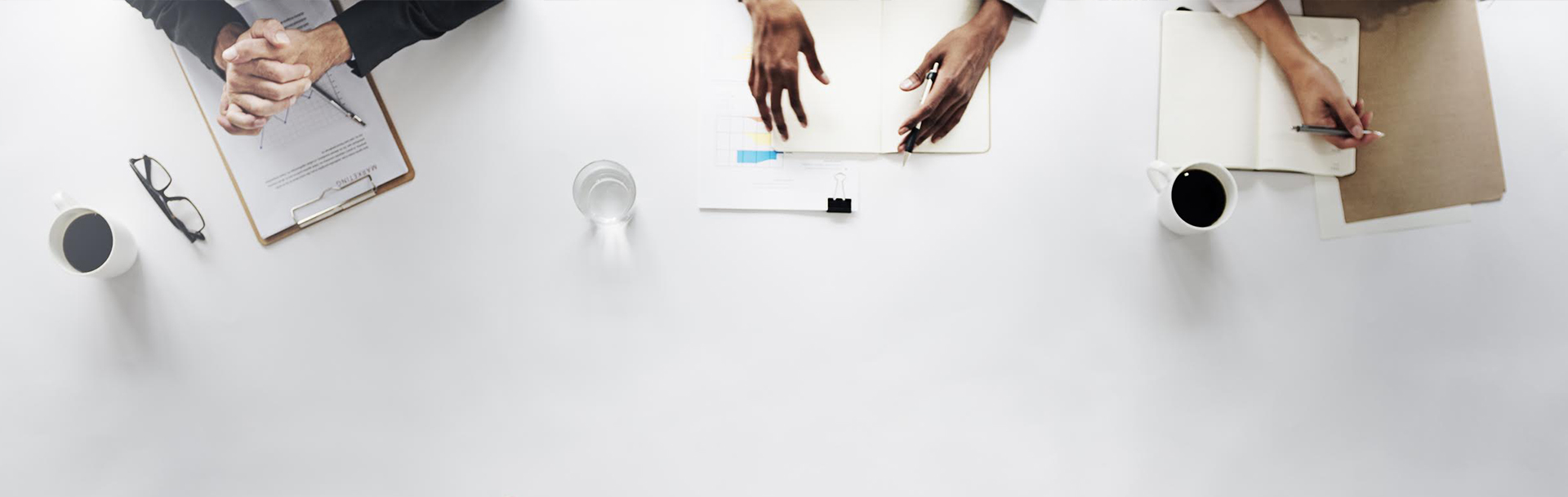 Abstract image of business people at table